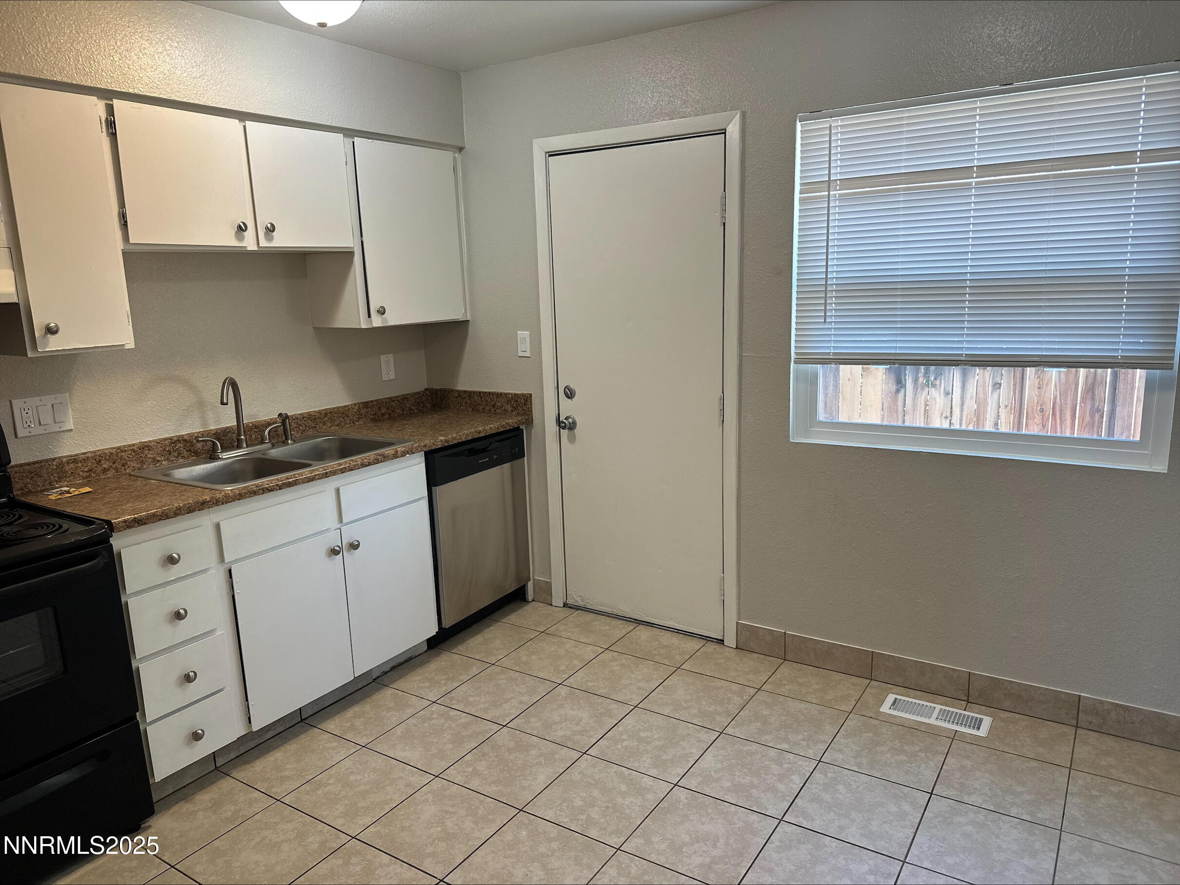 1424 East 9th Street, Unit 2 Reno, NV 89512 - Photo 9 of 20 a kitchen with a cabinets and window