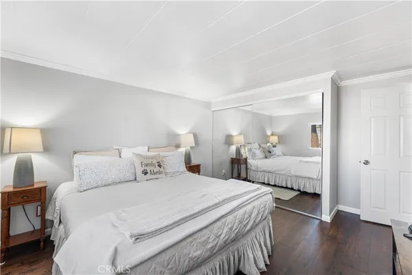 a bedroom with a bed and a view of bedroom