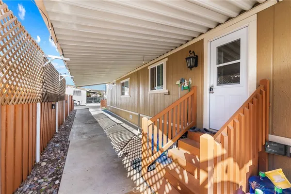a view of a house with wooden stairs