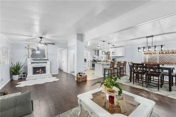 a living room with furniture and fireplace
