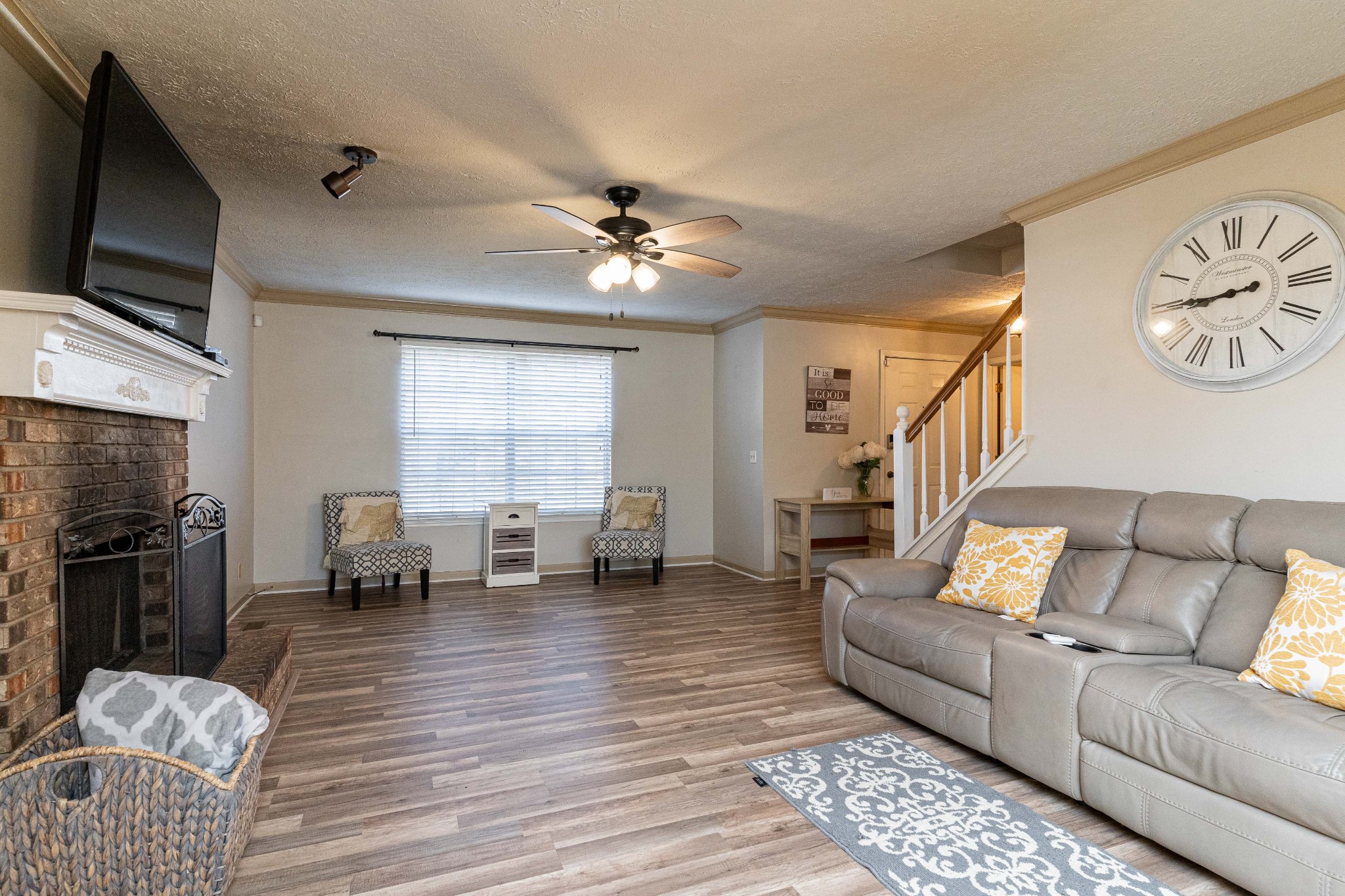 1016 Aldersgate Road Antioch, TN 37013 - Photo 7 of 31 a living room with furniture flat screen tv and a fireplace