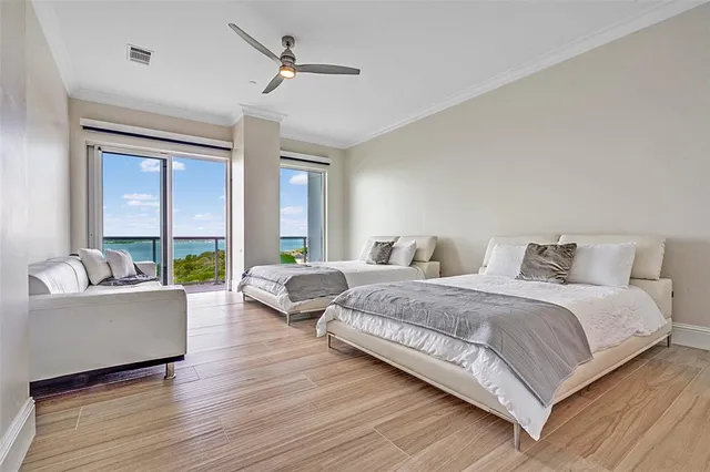 a spacious bedroom with a bed and a couch