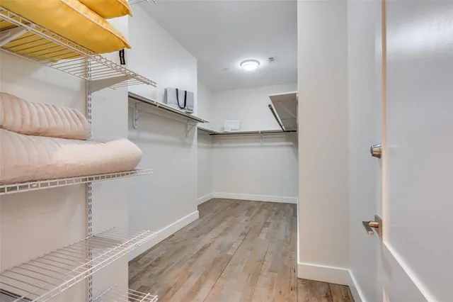 a room with cabinets and a wooden floor