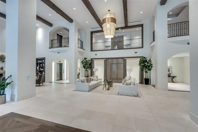a view of a livingroom with furniture and staircase