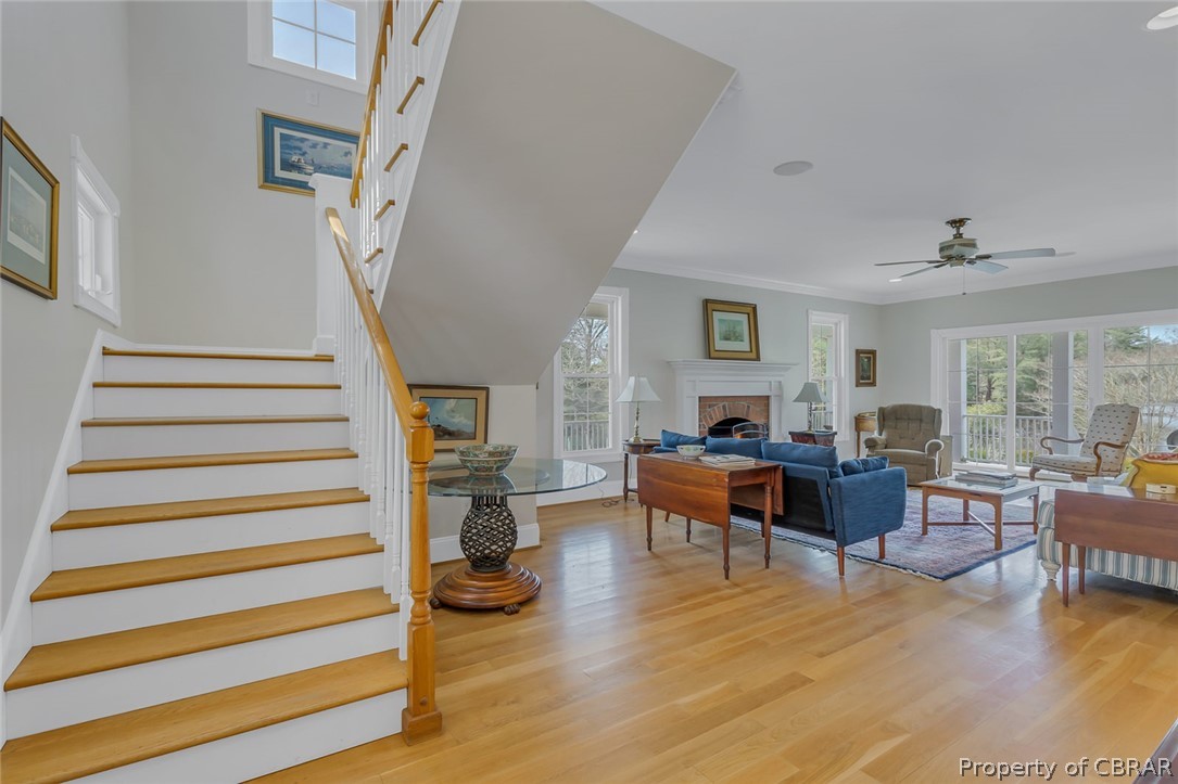507 Sunnybank Road Reedville, VA 22539 - Photo 19 of 48 Stairs featuring ornamental molding, ceiling fan, and light wood-type flooring