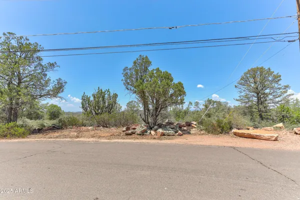 a view of a street with a building in the background