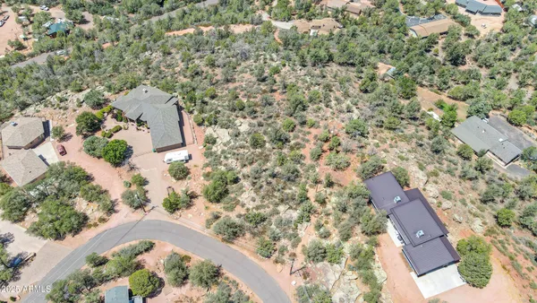 an aerial view of residential house and outdoor space