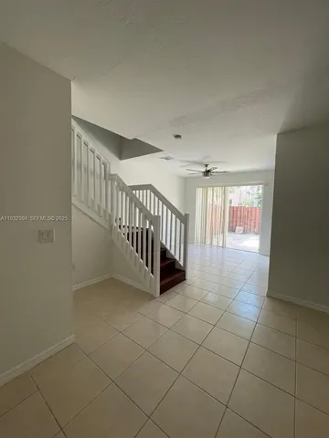 a view of a hallway with windows