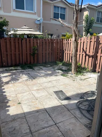 a view of a backyard of the house