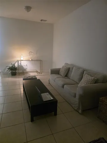 a living room with a couch and a stove