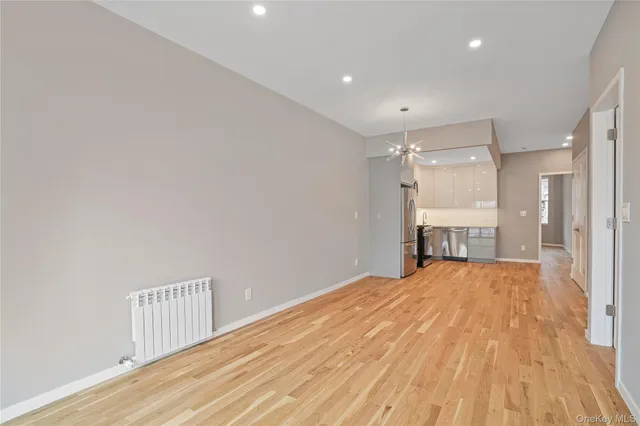 a large kitchen with a sink and a stove top oven