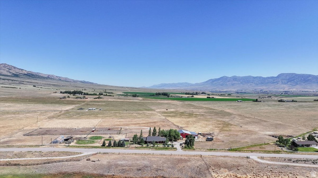 1634 West Arimo Road Arimo, ID 83214 - Photo 65 of 89 Expansive rural property featuring a single-story residence, multiple outbuildings, and extensive open land