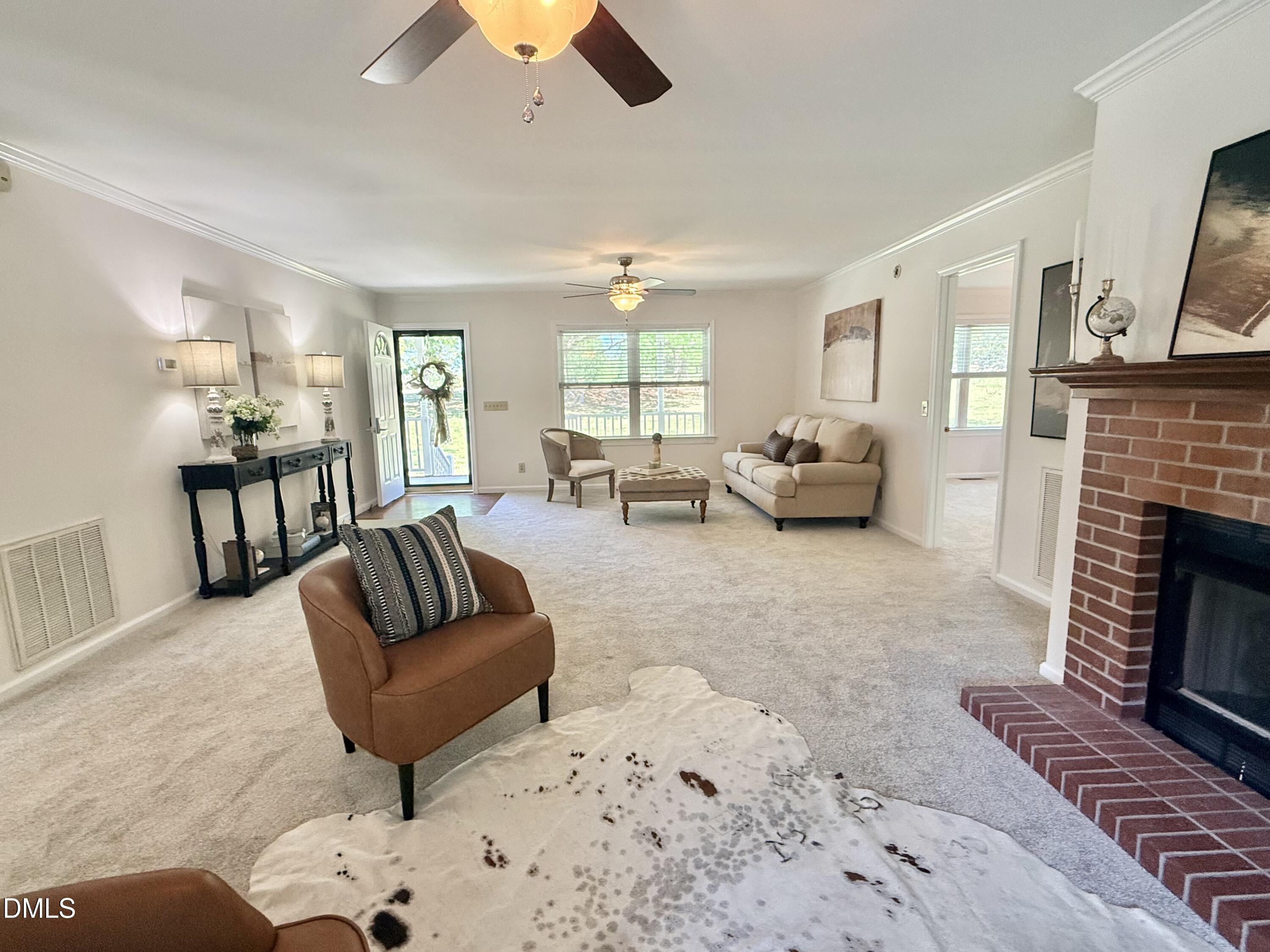 2429 Halifax Road Roxboro, NC 27573 - Photo 5 of 54 a living room with furniture and a fireplace