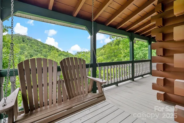 a view of balcony with wooden floor