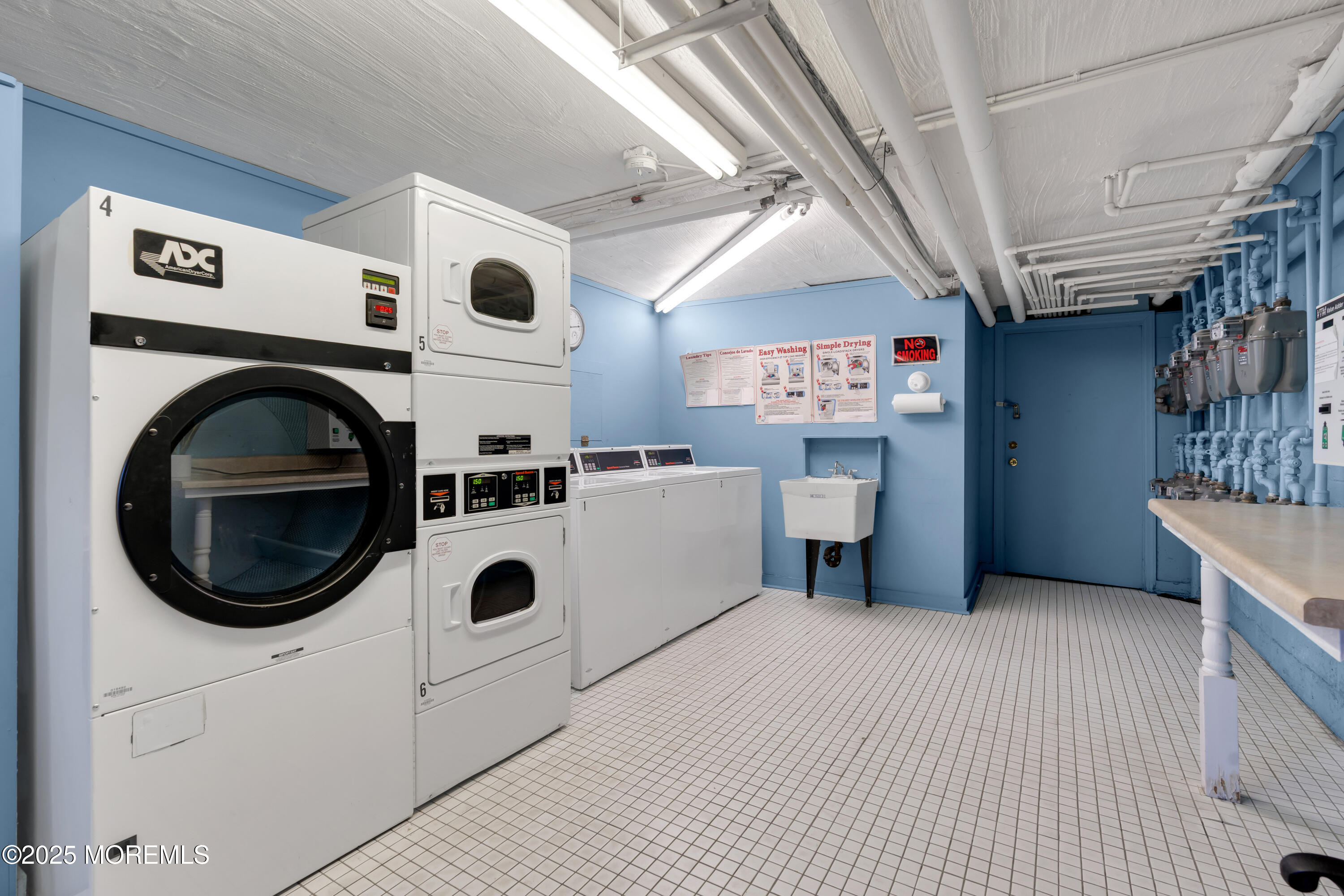 283 Spring Street, Unit 3A Red Bank, NJ 07701 - Photo 16 of 21 a view of a livingroom with washer and dryer