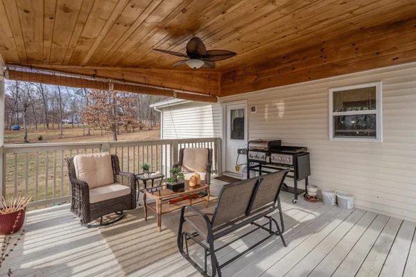 a view of a patio with wooden floor