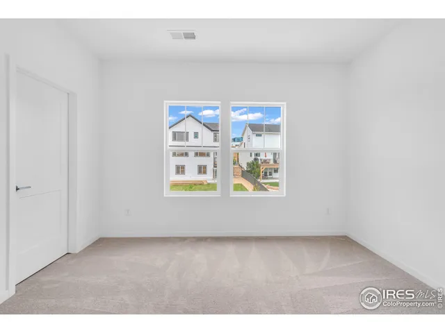a view of an empty room and window