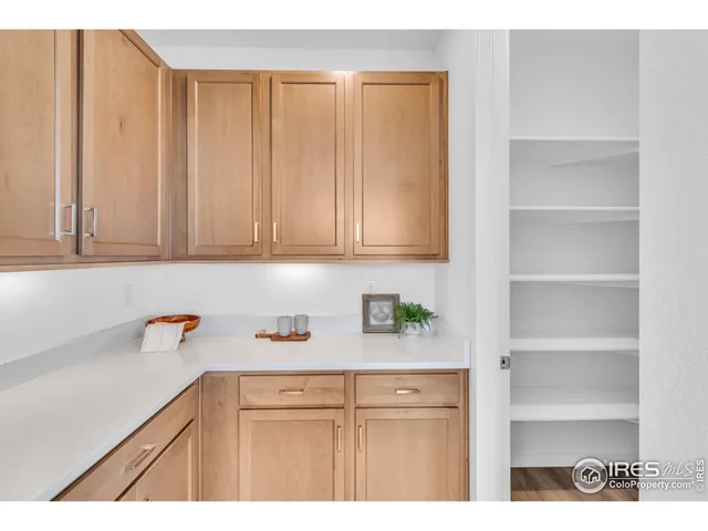 a kitchen with white cabinets and a sink