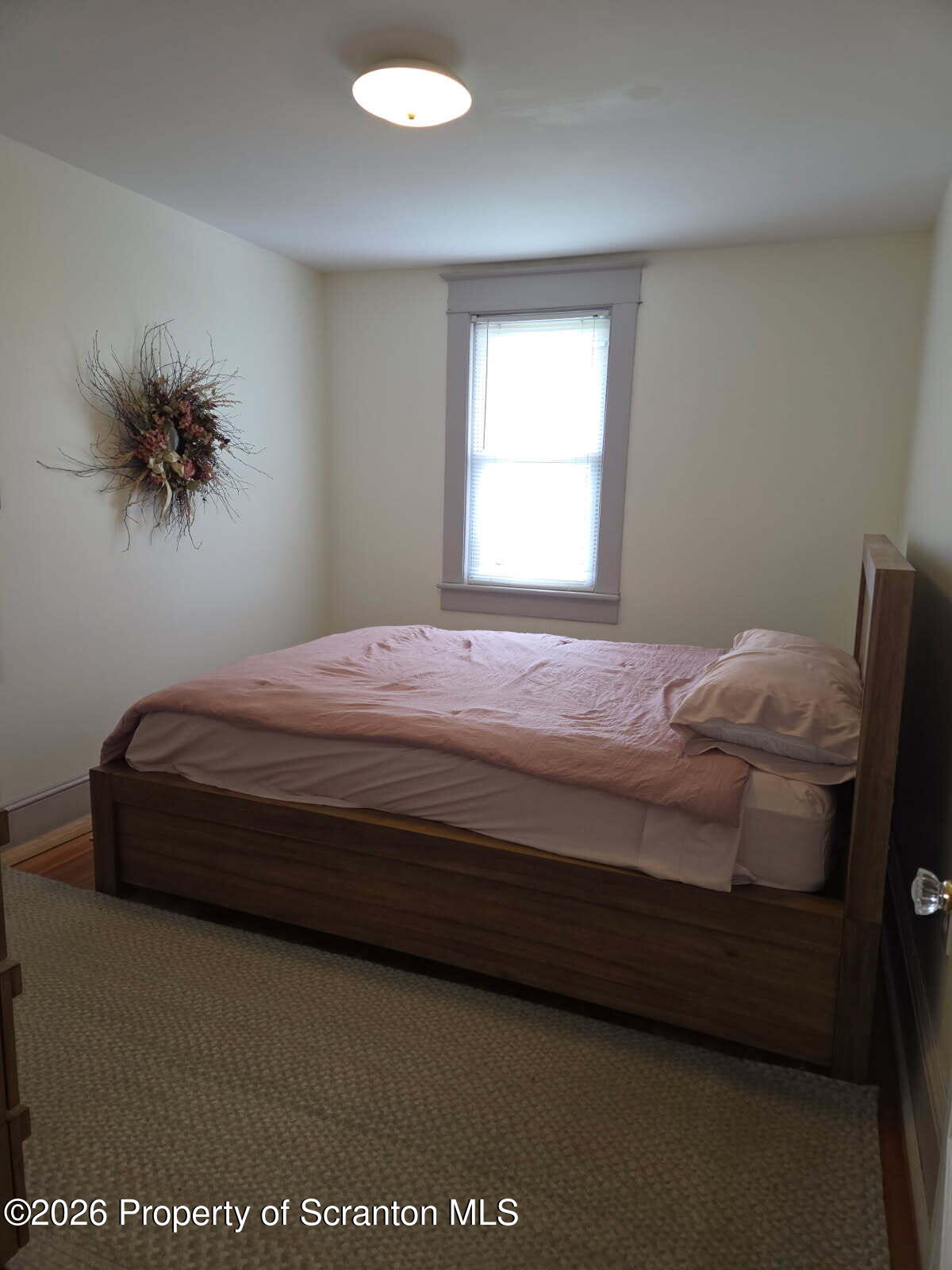 229 East Mountain Road Scranton, PA 18505 - Photo 31 of 47 a bedroom with a bed and a potted plant