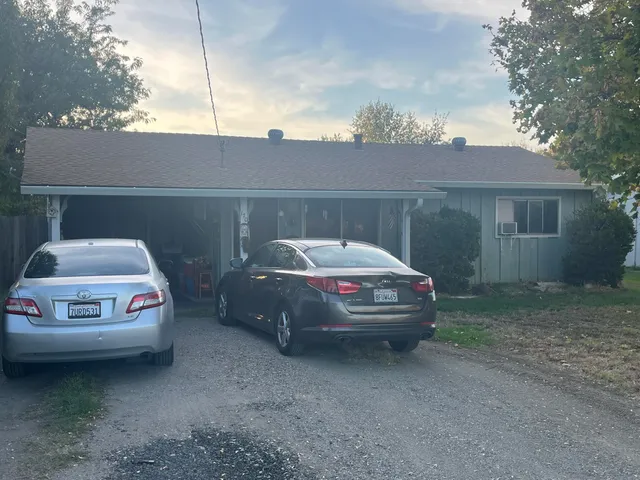 a car parked in front of a house