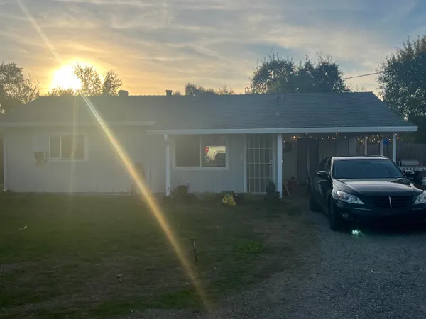 a view of a car in front of a house