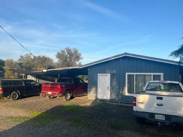 a view of a car park in front of house