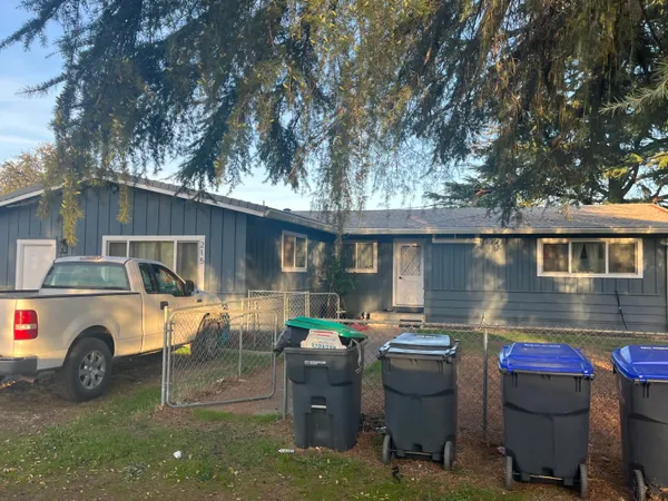 a view of a car park in front of house