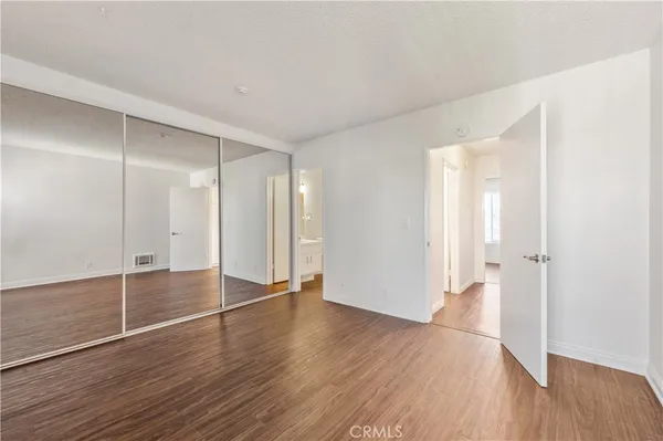 a sitting area with wooden floors