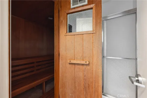 a living room with furniture or kitchen view and a wooden floor