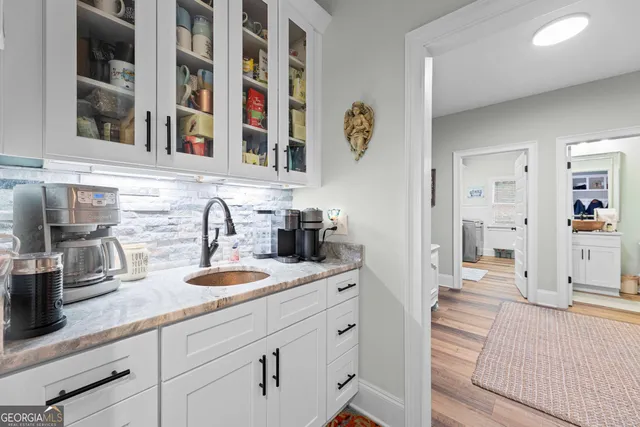 a kitchen with cabinets and window