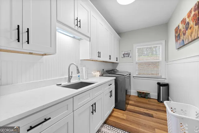 a kitchen with a sink and cabinets