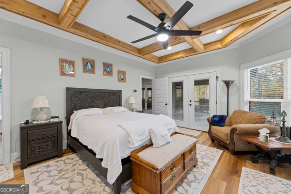a bedroom with a bed couch and a window