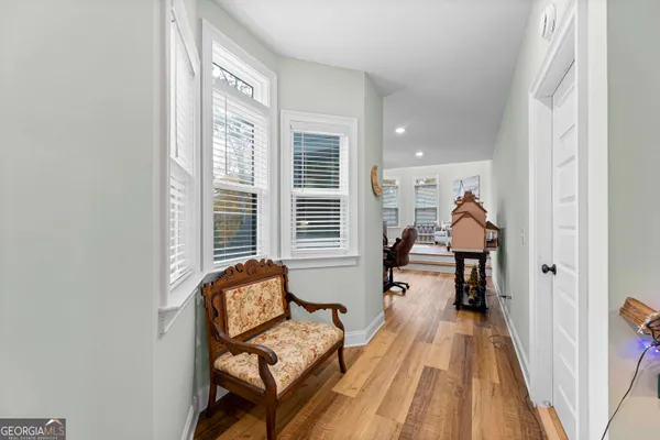 a bedroom with furniture and a clock