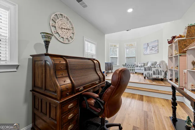 a living room with furniture and a table