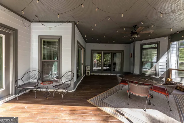 a view of a backyard with sitting area