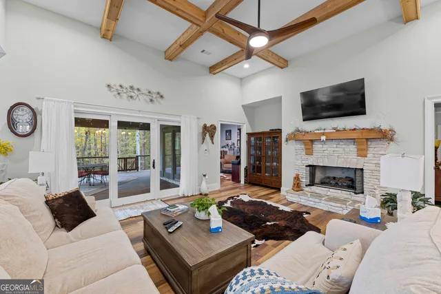 a living room with furniture fireplace and flat screen tv