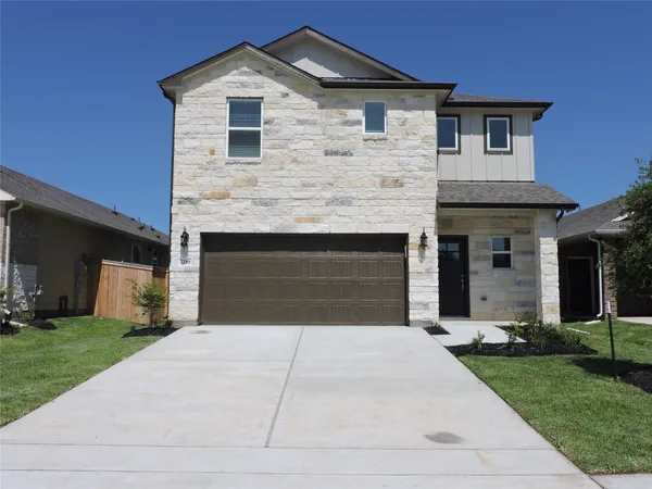a front view of a house with yard