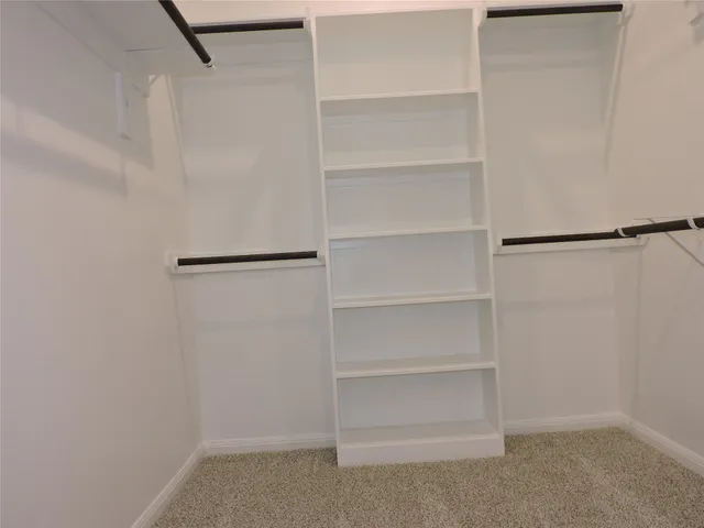 a view of an empty walk in closet
