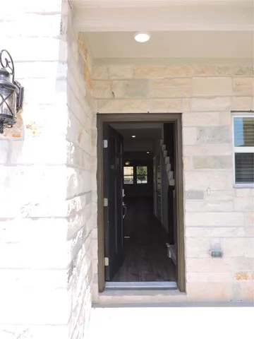 a view of a glass door of a house