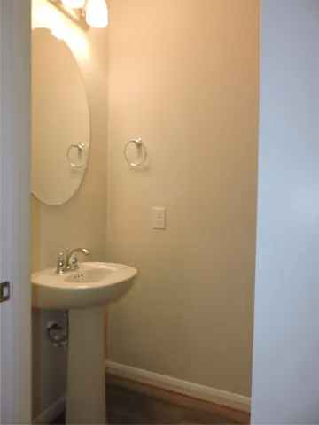a bathroom with a sink and mirror