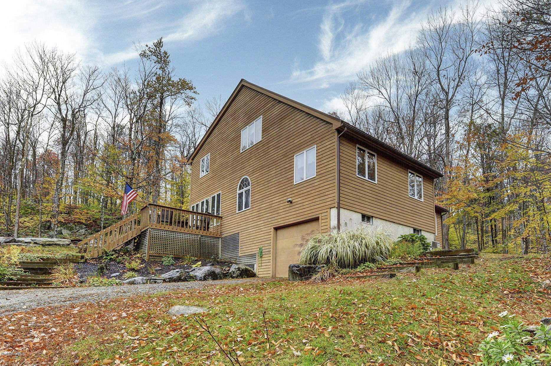 99 Jacobs Hollow Road Becket, MA 01223 - Photo 1 of 39 a view of a house with a yard