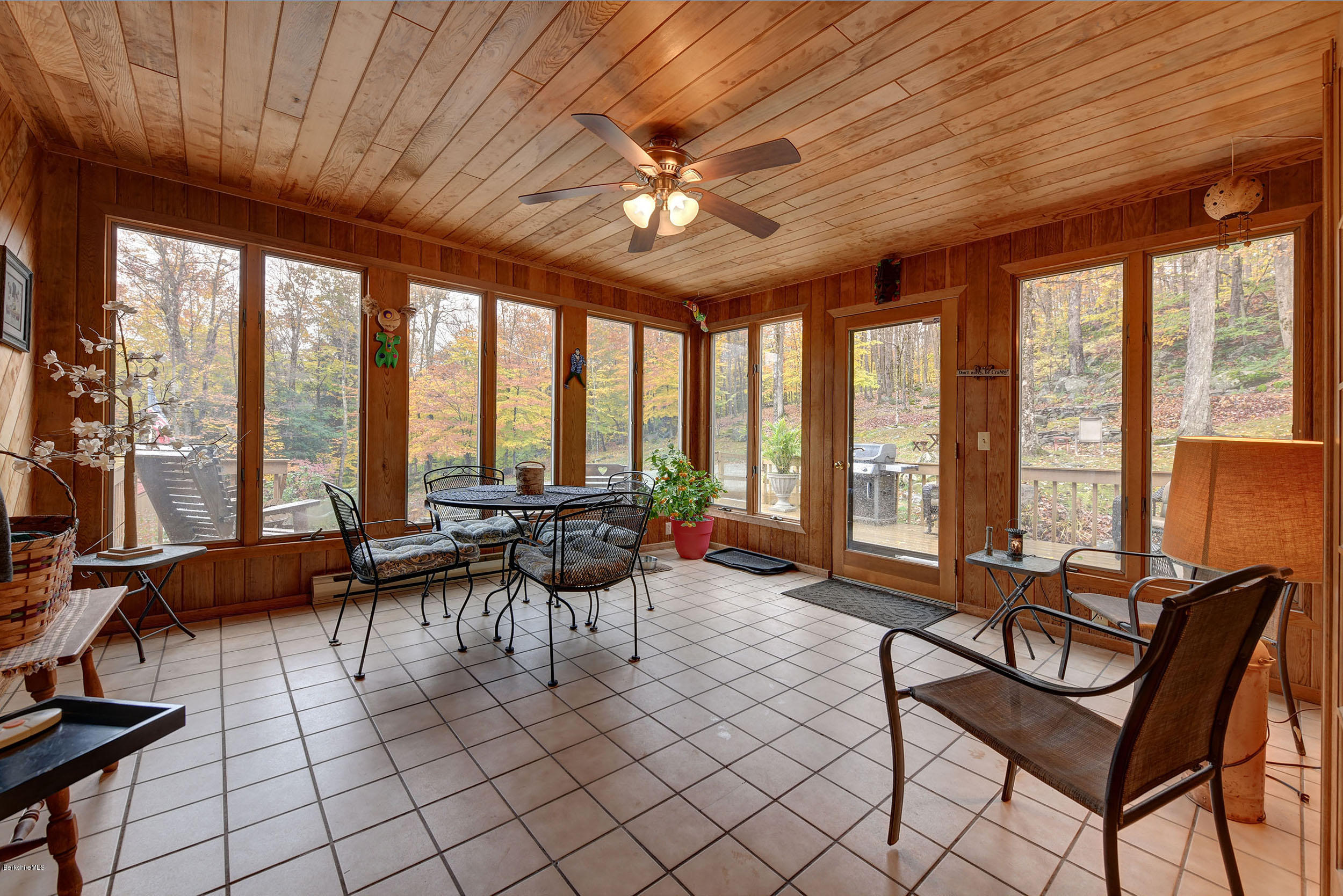 99 Jacobs Hollow Road Becket, MA 01223 - Photo 11 of 39 a living room with furniture and a large window