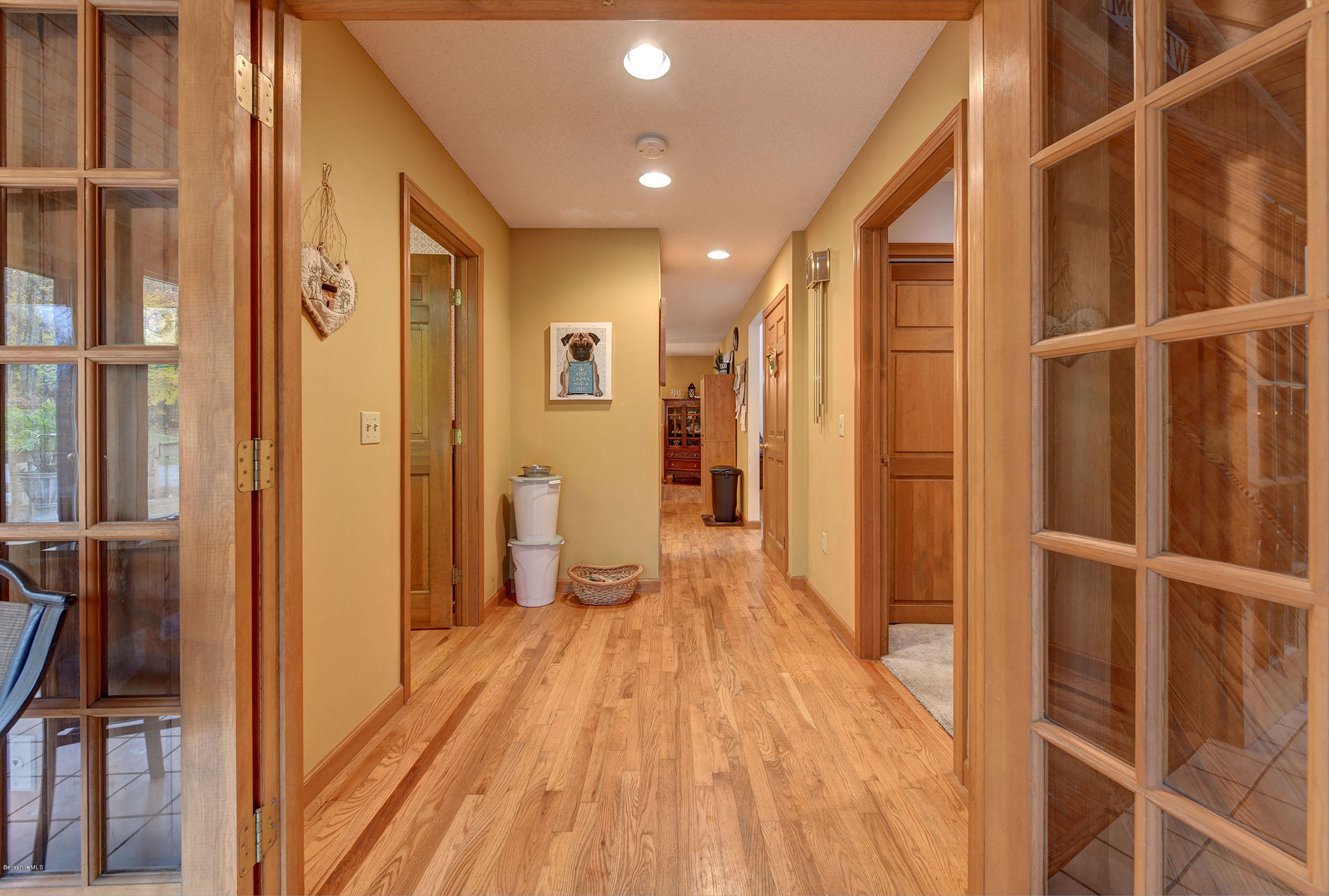 99 Jacobs Hollow Road Becket, MA 01223 - Photo 12 of 39 a view of a hallway with wooden floor and staircase