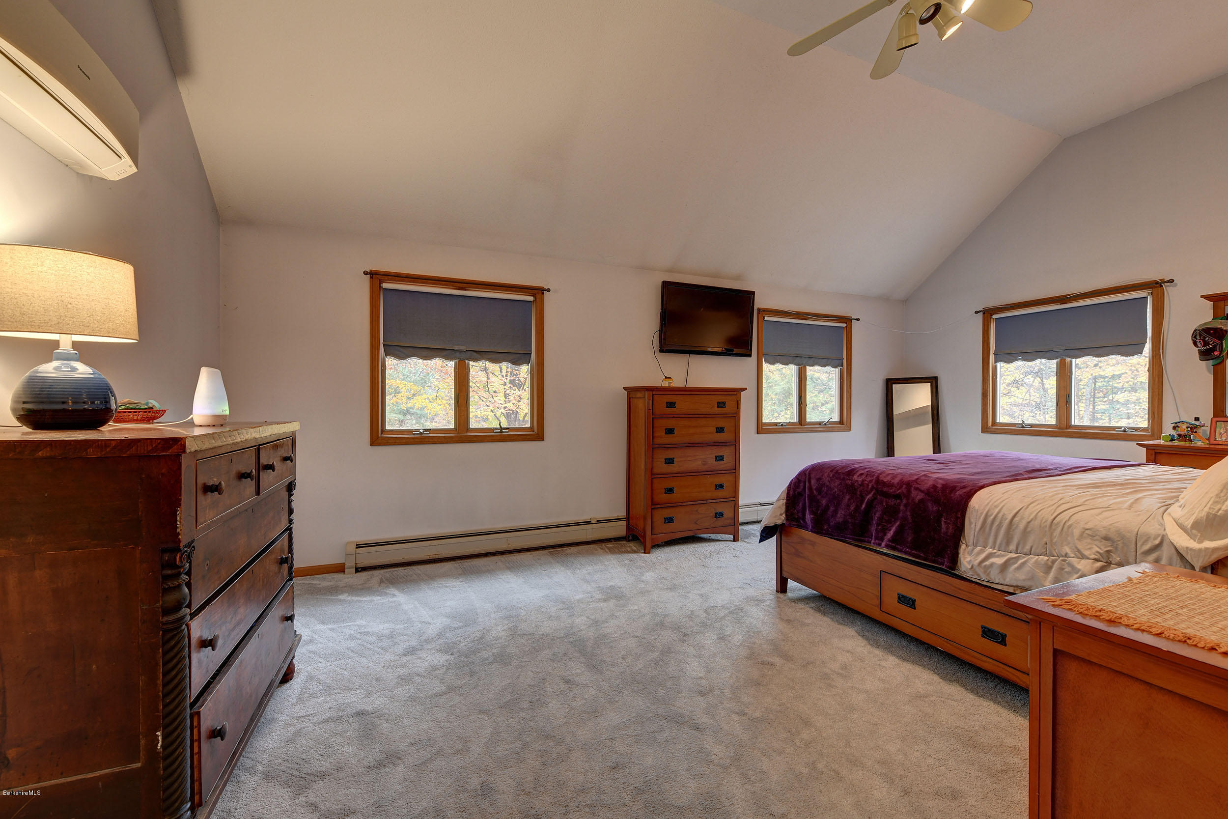 99 Jacobs Hollow Road Becket, MA 01223 - Photo 16 of 39 a bedroom with a bed and a window