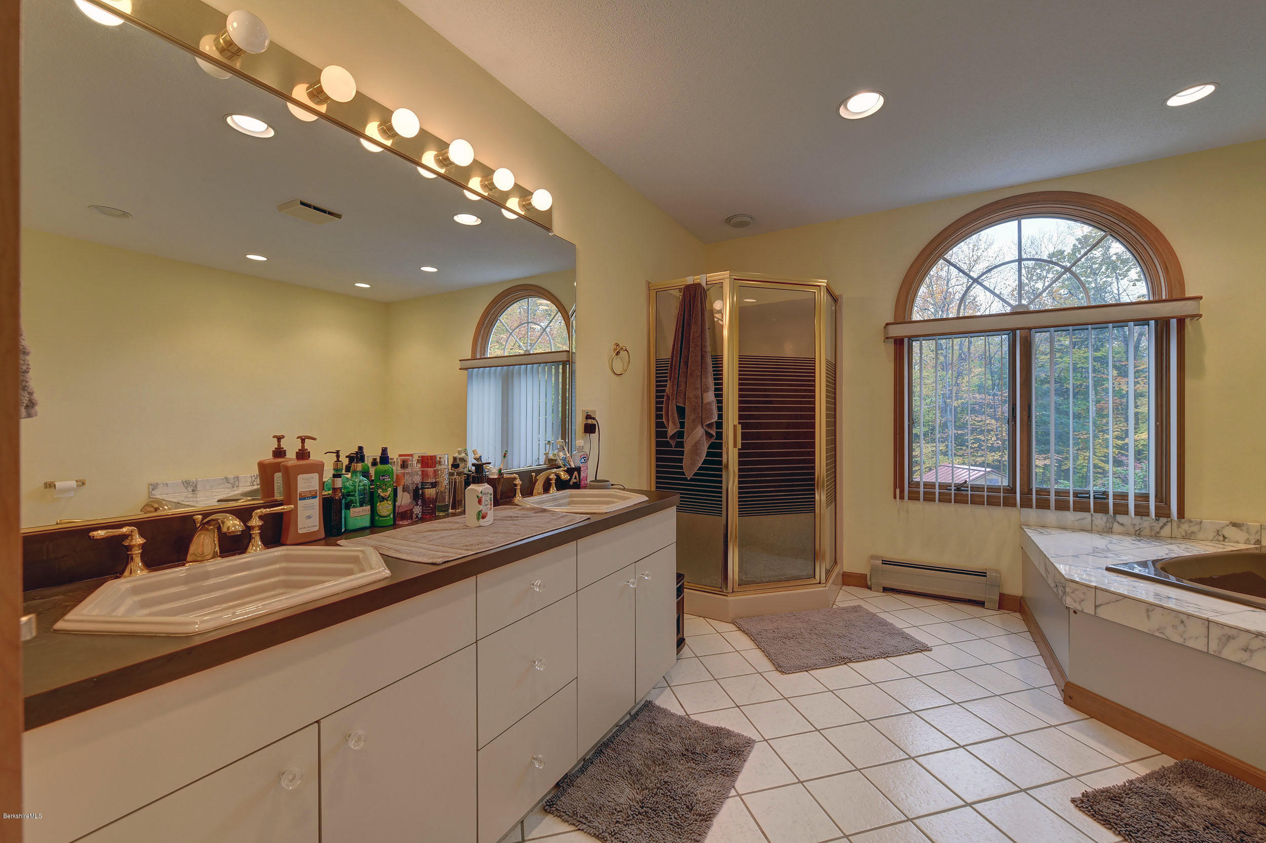 99 Jacobs Hollow Road Becket, MA 01223 - Photo 17 of 39 a large bathroom with a large tub and sink