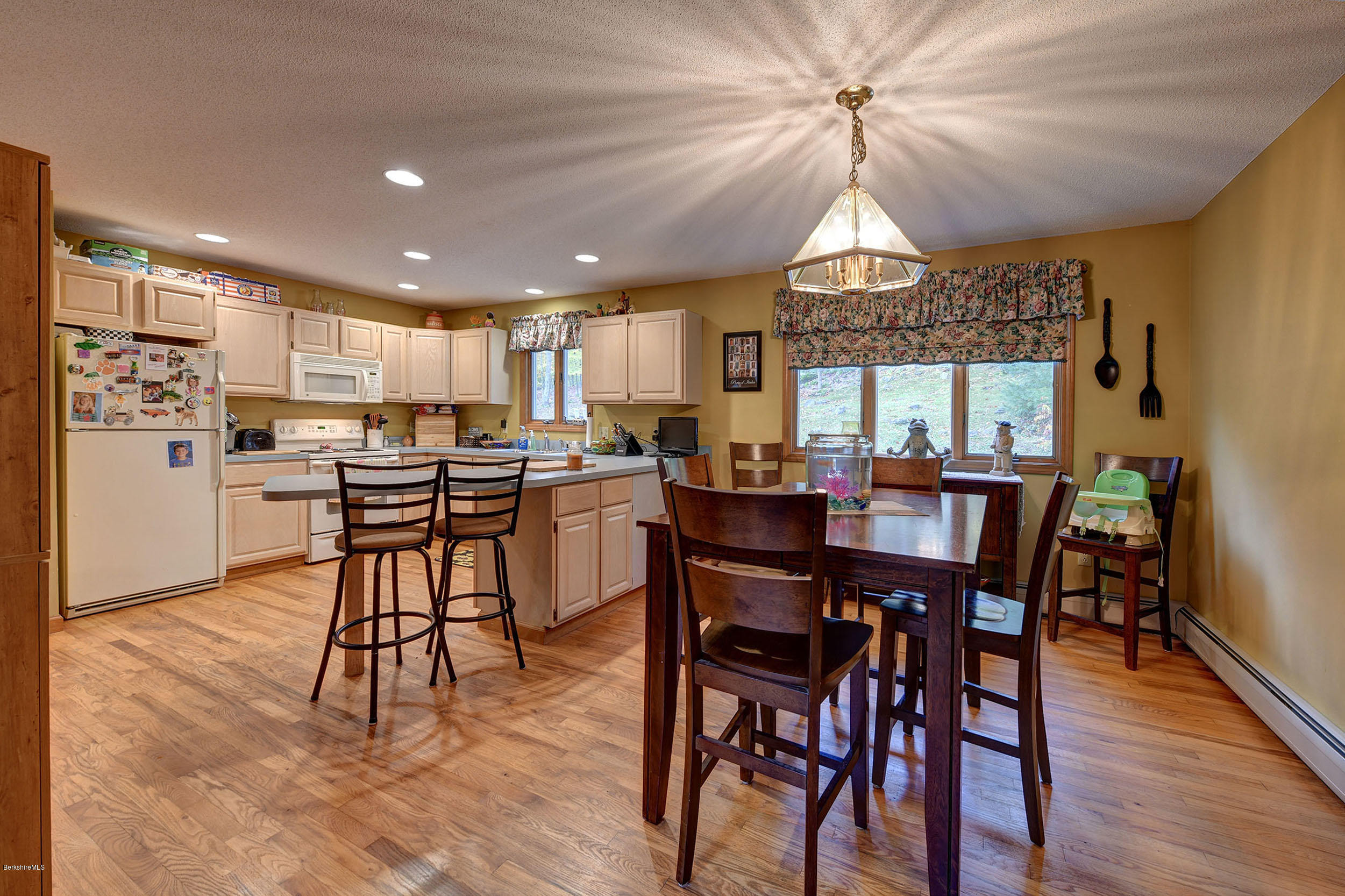 99 Jacobs Hollow Road Becket, MA 01223 - Photo 23 of 39 a view of a dining room with furniture window and wooden floor