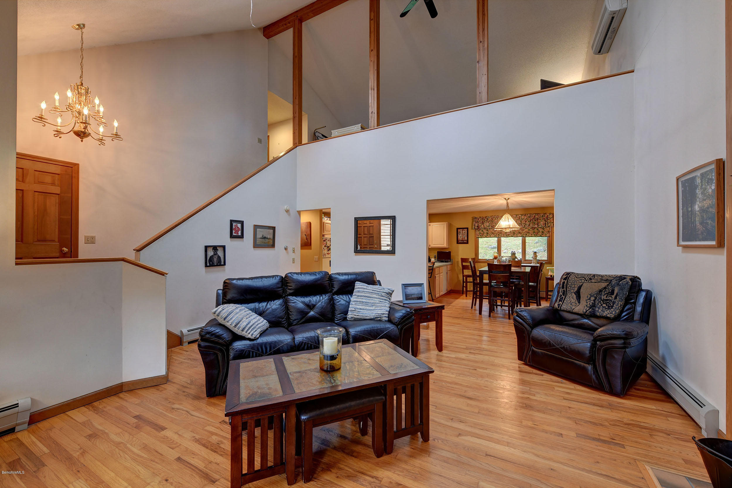 99 Jacobs Hollow Road Becket, MA 01223 - Photo 27 of 39 a living room with furniture a couch and wooden floor