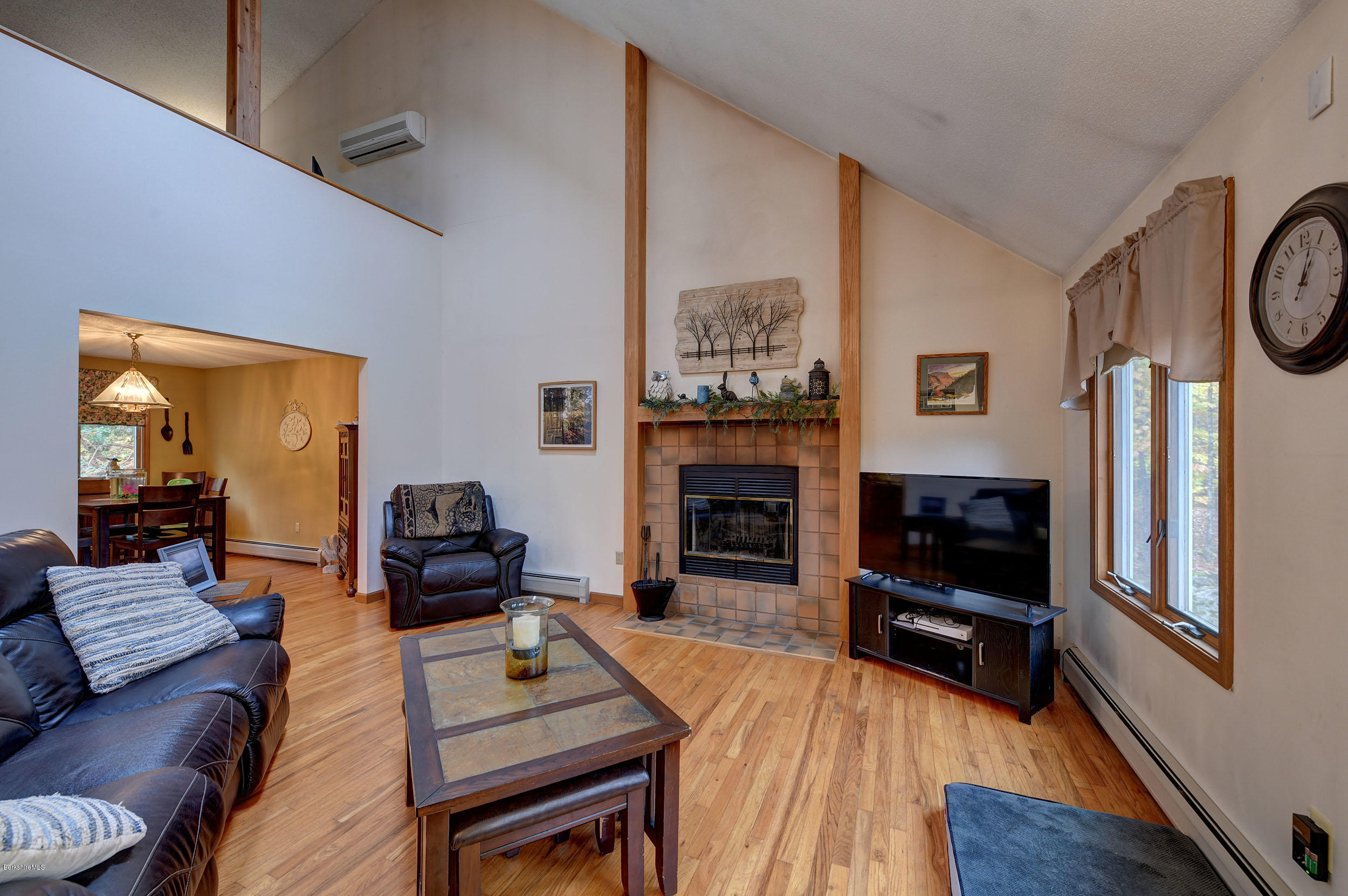 99 Jacobs Hollow Road Becket, MA 01223 - Photo 28 of 39 a living room with furniture and a fireplace