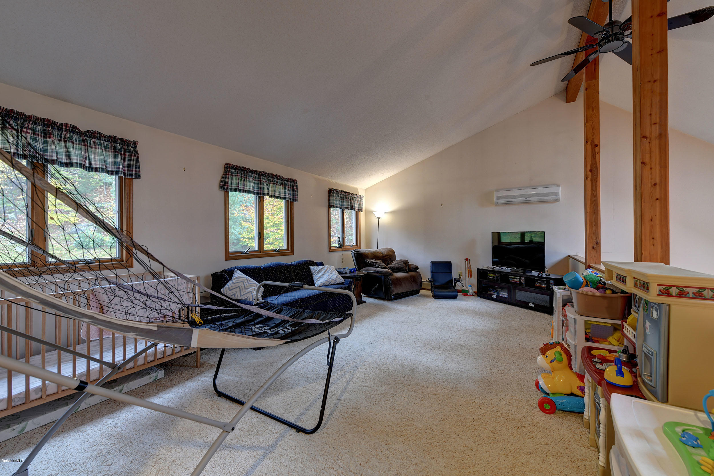 99 Jacobs Hollow Road Becket, MA 01223 - Photo 30 of 39 a living room with furniture and a window