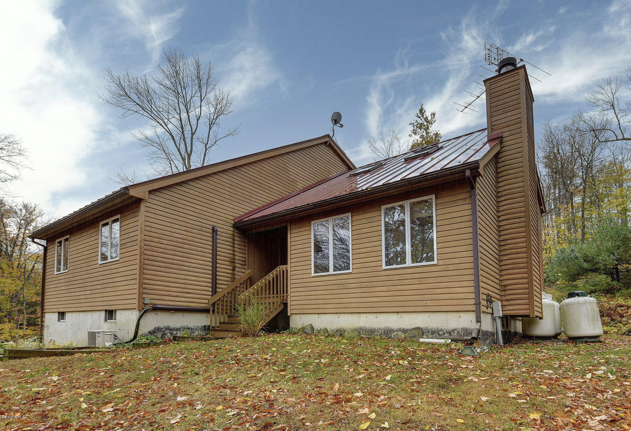99 Jacobs Hollow Road Becket, MA 01223 - Photo 3 of 39 a view of a house with a yard
